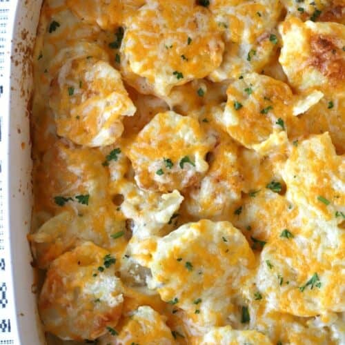 homemade scalloped potatoes in a white baking dish