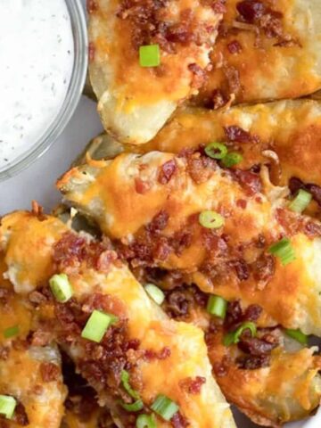 loaded baked potato skins reicipe with cheese and bacon, easy baked potato skins recipe