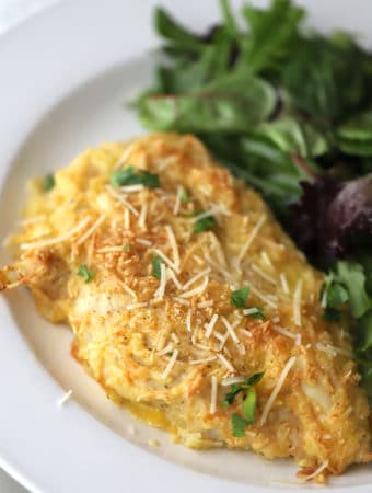 ranch parmesean chicken on a white plate