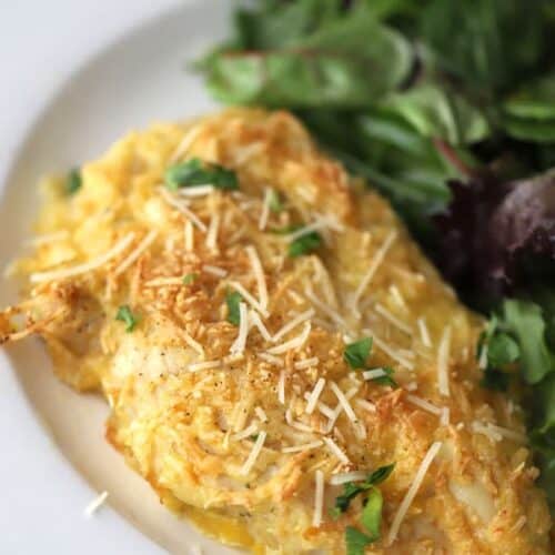 ranch parmesean chicken on a white plate