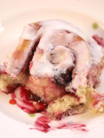 triple berry sweet roll with lemon icing