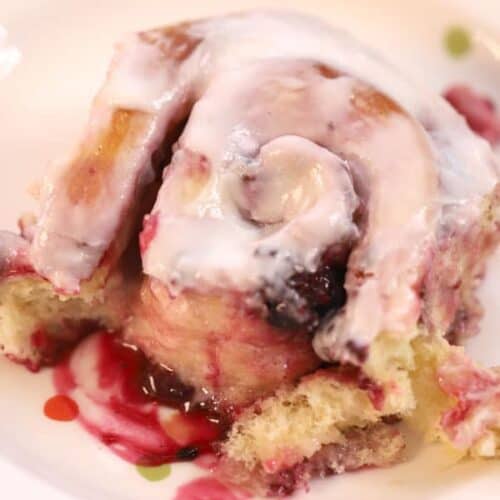 triple berry sweet roll with lemon icing