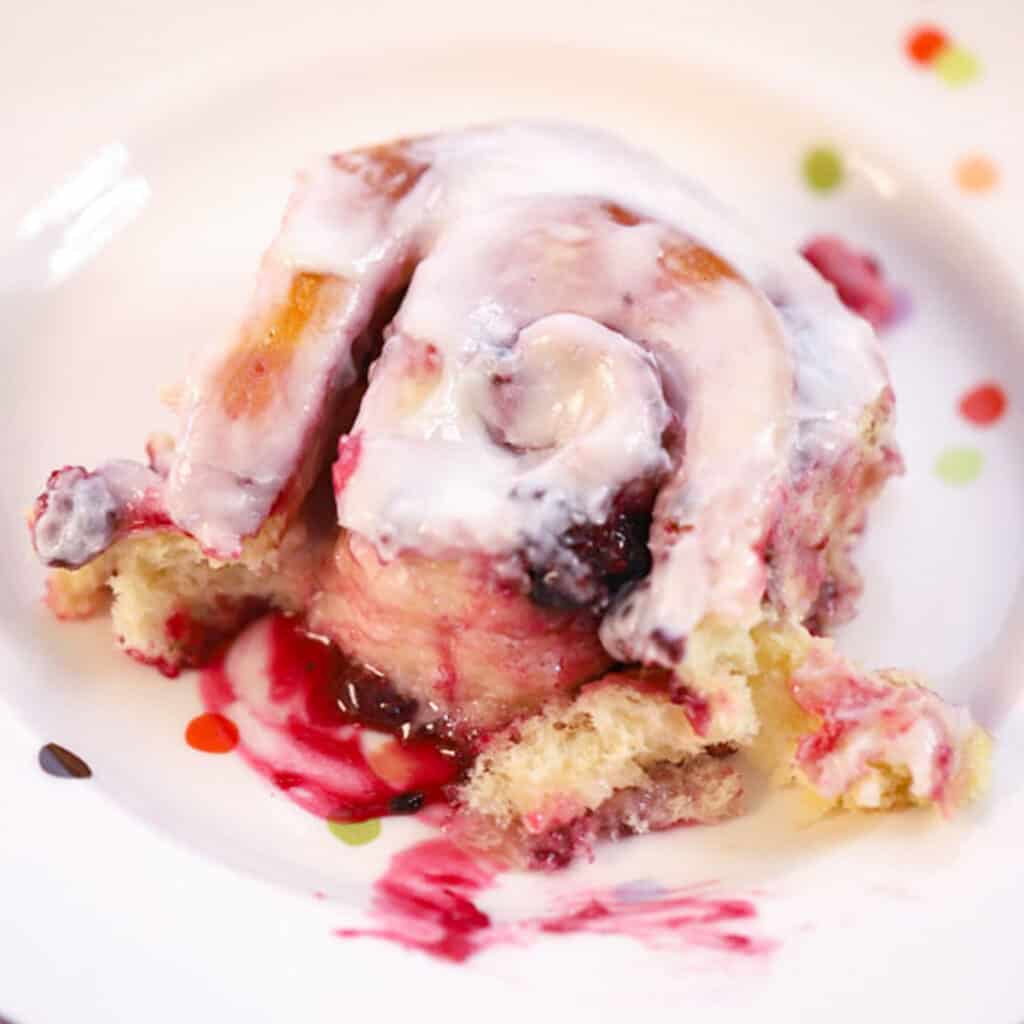 triple berry sweet roll with lemon icing, a fruity cinnamon roll variation.