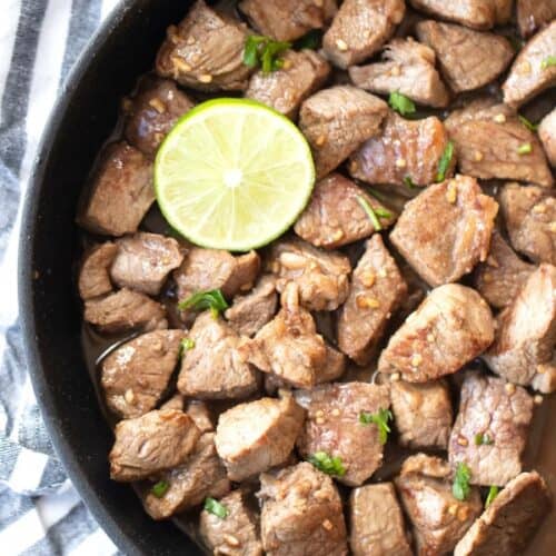 These chili lime steak bites with a lime wedge