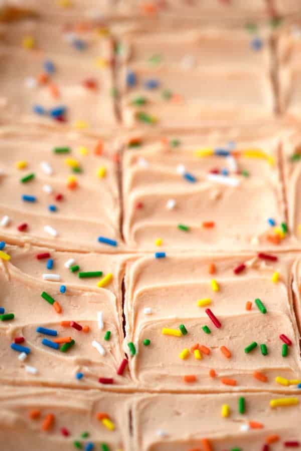 cut cookie bars with dreamcicle frosting