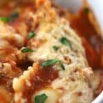 crockpot lasagna with ravioli- in a large white bowl, ravioli lasagna crockpot recipe.