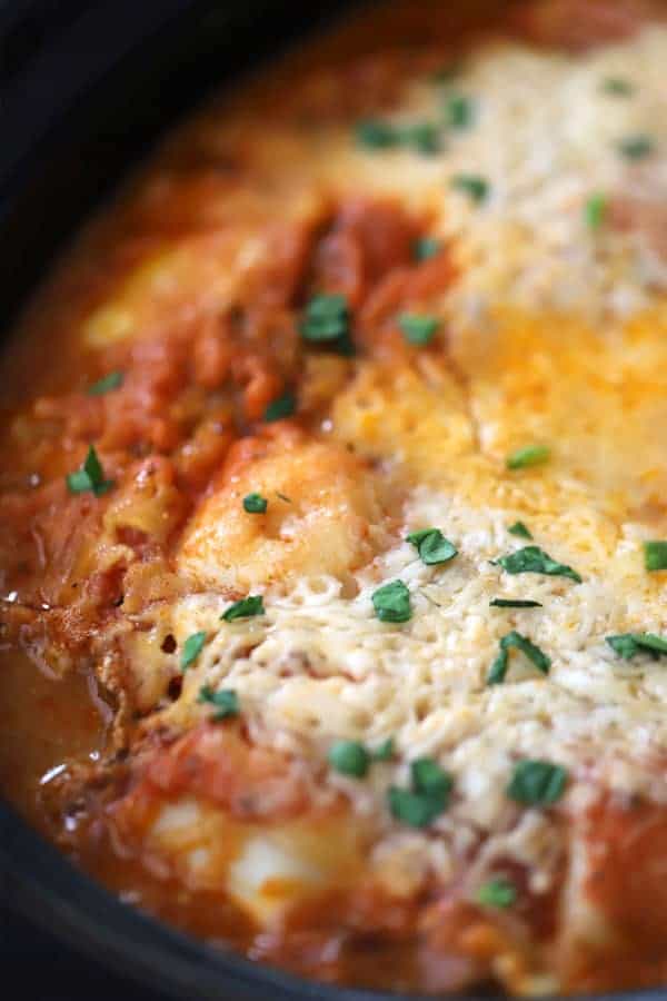 the cheesy top of ravioli lasagna crockpot, ravioli crockpot lasagna with melted cheese on top. 