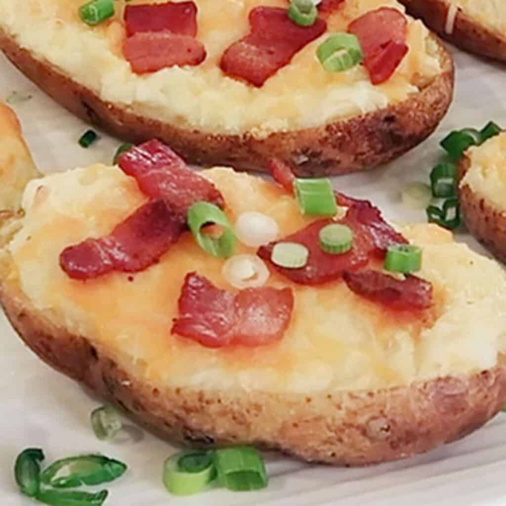 Twice baked potatoes topped with bacon and green onions. Valentine meal ideas. 
