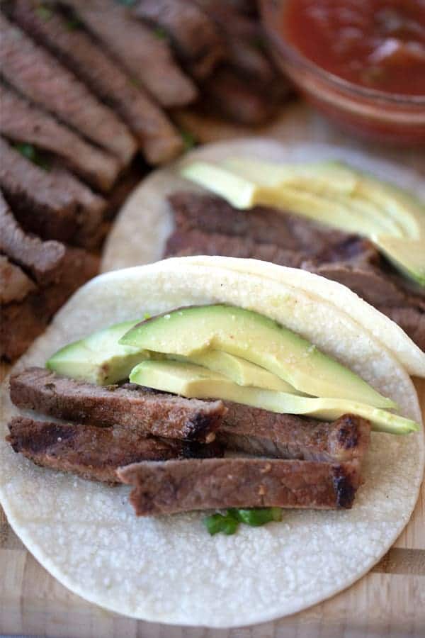 how to cook carne asada the best carne asada tacos in corn tortilla shell with avocado.