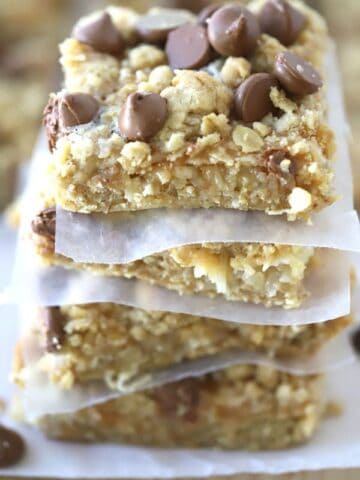 Coconut Caramel Magic Bars stacked on top of each other