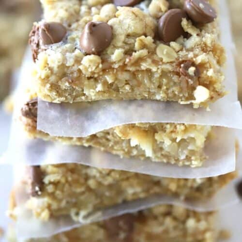 Coconut Caramel Magic Bars stacked on top of each other