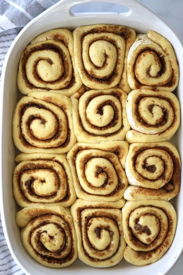 Einkorn cinnamon rolls rising in a baking dish