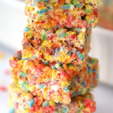 fruity pebbles rice rispy treats stacked on top of each other