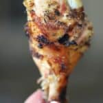a single drumstick being held in one hand, Garlic and Herb Chicken Drumstick Recipe, a healthy chicken drumsticks recipe