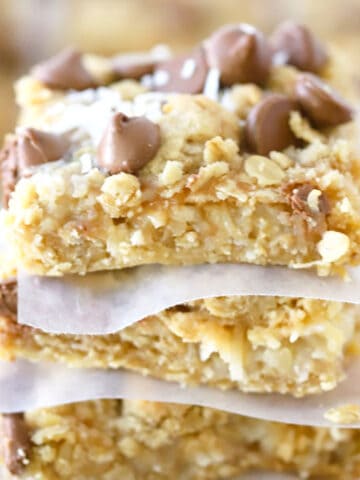 Coconut Caramel Magic Bars stacked on top of each other