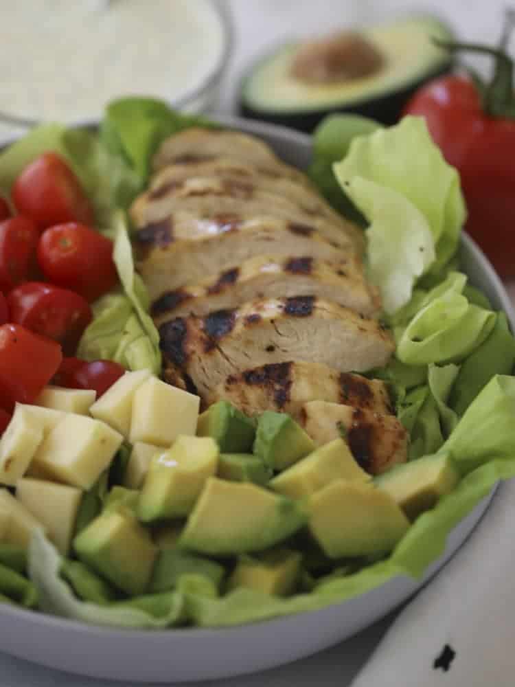Californial Grilled Chicken Salad with grilled chicken on a bed of vegetables