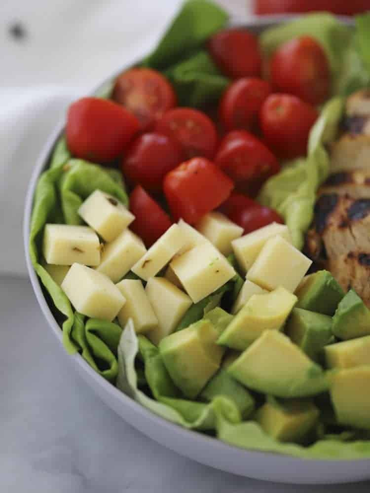 California chcken Salad showing pepperjack cheese, tomatoes, avocado, and lettuce