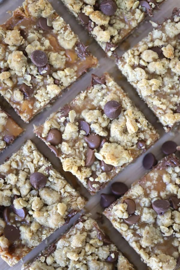 Caramel Peanut Butter Cookie Bars  cut into squares and lined up on a baking sheet.