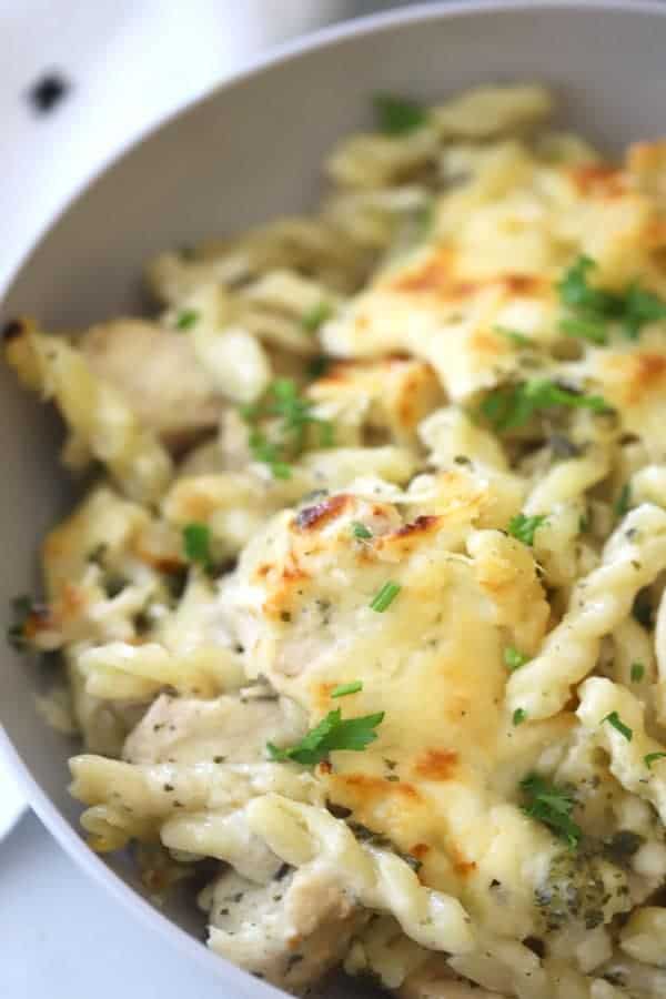 chicken and pesto pasta in a bowl