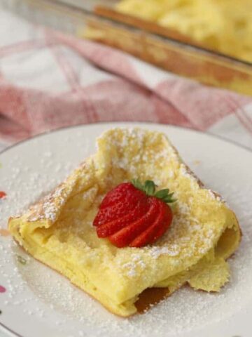 German Pancakes on a plate with a strawberrie