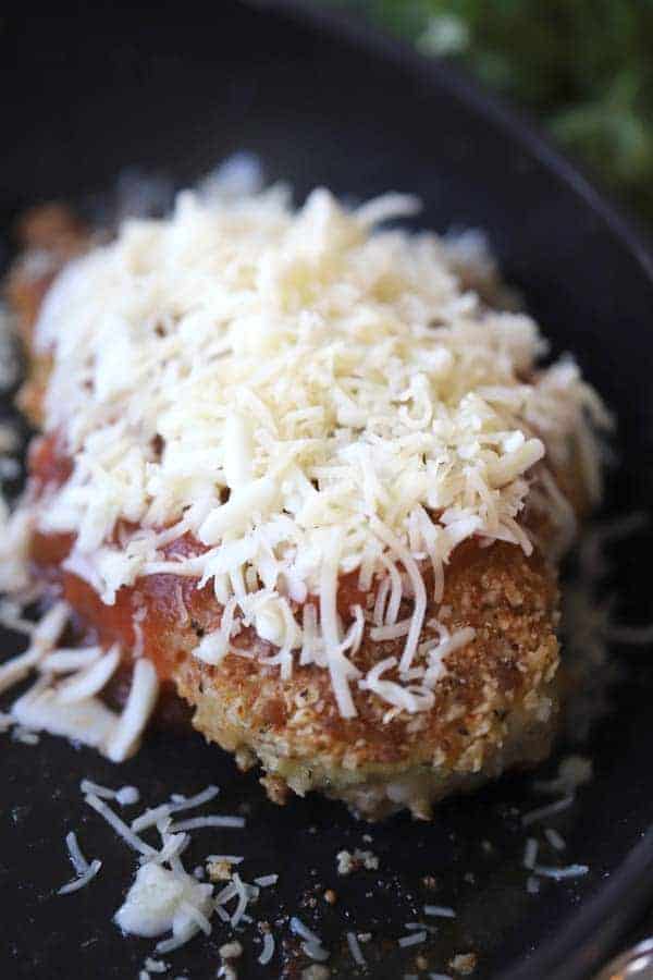 simple chicken parmesan recipe smothered in mozzarella and parmesan cheese. 