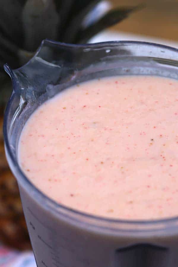 A blender full of strawberry virgin pina colada recipe