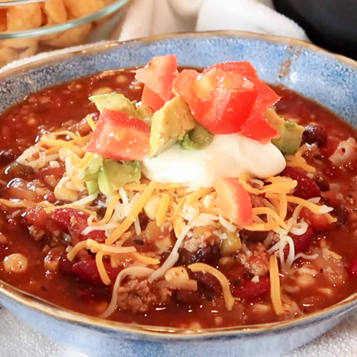 simple taco soup recipe being scooped into a blue bowl