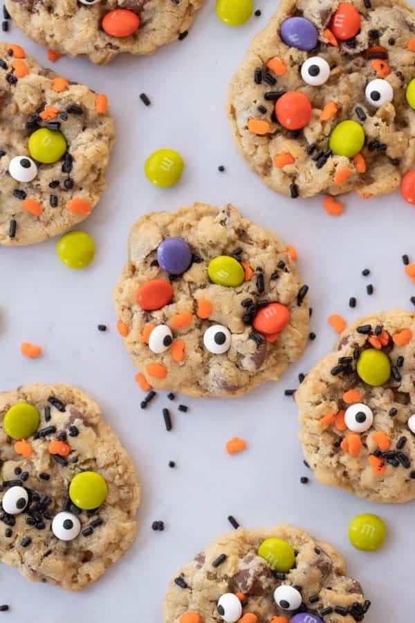 Monster cookies decorated with M&Ms, sprinkles and candy eyeballs.