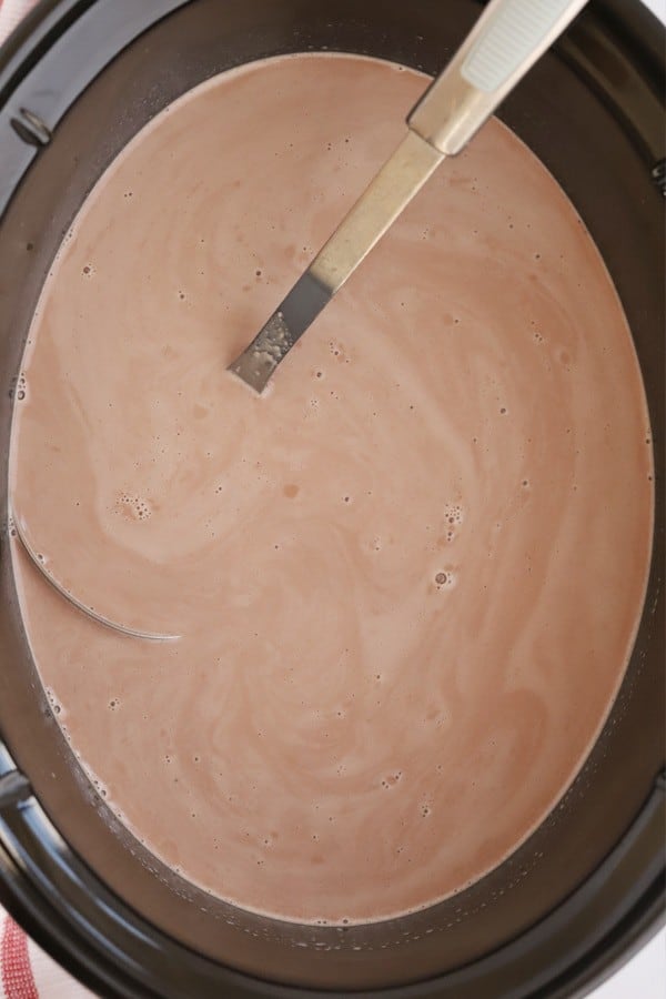 A slow cooker full of hot chocolate. diy hot chocolate bar. diy hot cocoa bar. 