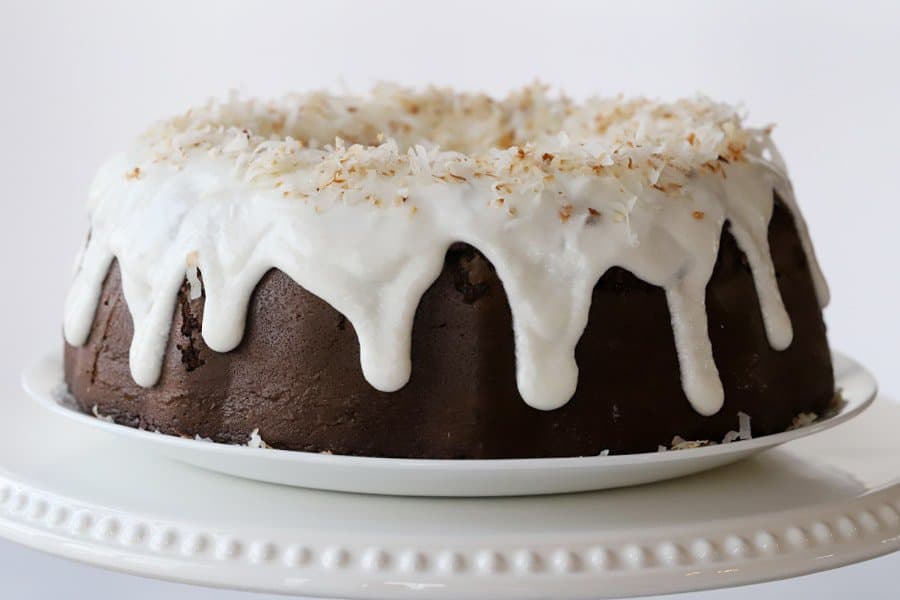 chocolate bundt cake with coconut filling on platter