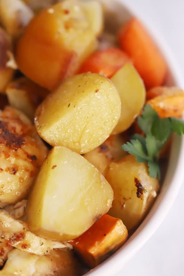 roasted vegetables with chicken, roast chicken and potatoes.