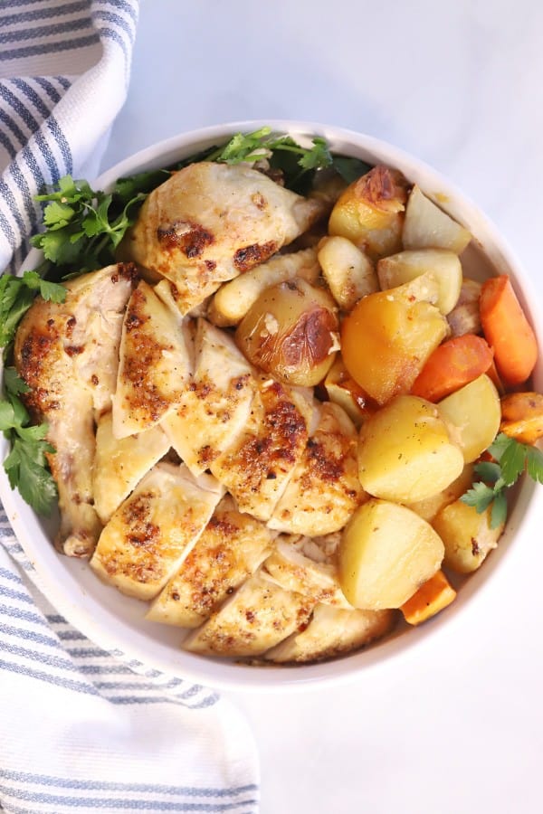 roasted chicken and vegetables, chicken and potatoes in the oven.