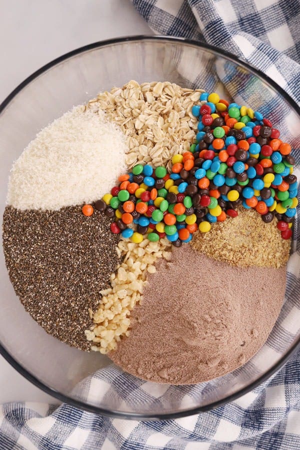 ingredients to make chia oatmeal energy balls in a large glass bowl