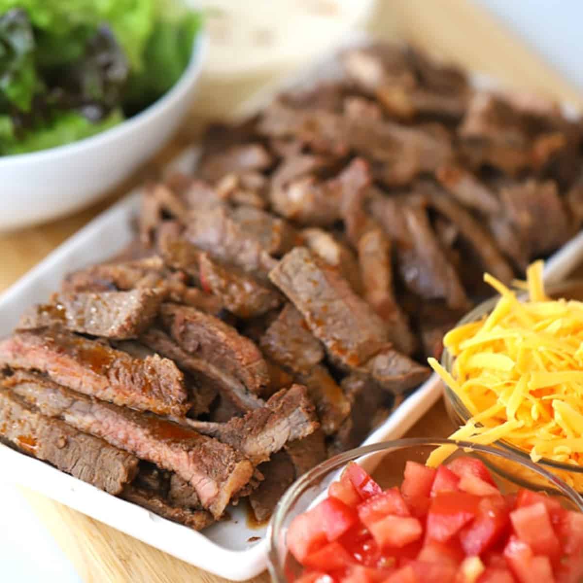 best carne asada recipe, chipotle carne asada recipe ingredients on a platter, carne asada tacos,