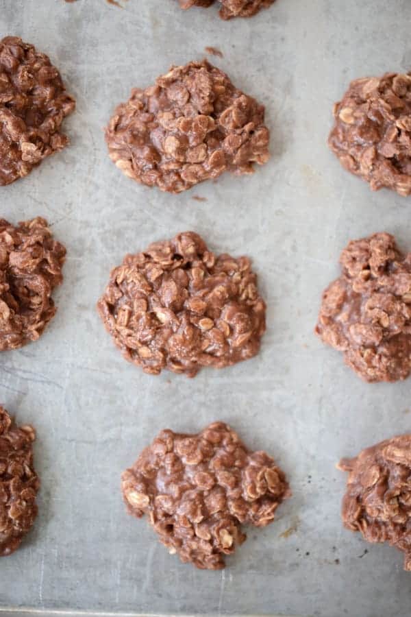 easy no-bake nutella recipes, nutella cookies ined up on a greased baking sheet