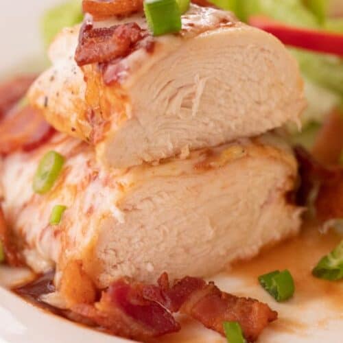 oven bbq chicken breast topped with cheese, bacon bits and green onions.