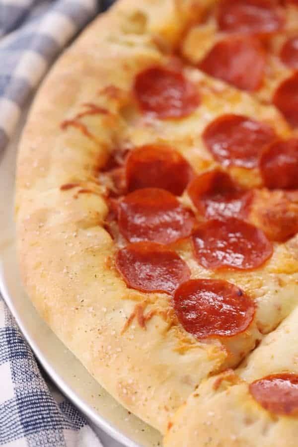 how to make stuffed crust pizza, Pepperoni pizza on a pizza plate.