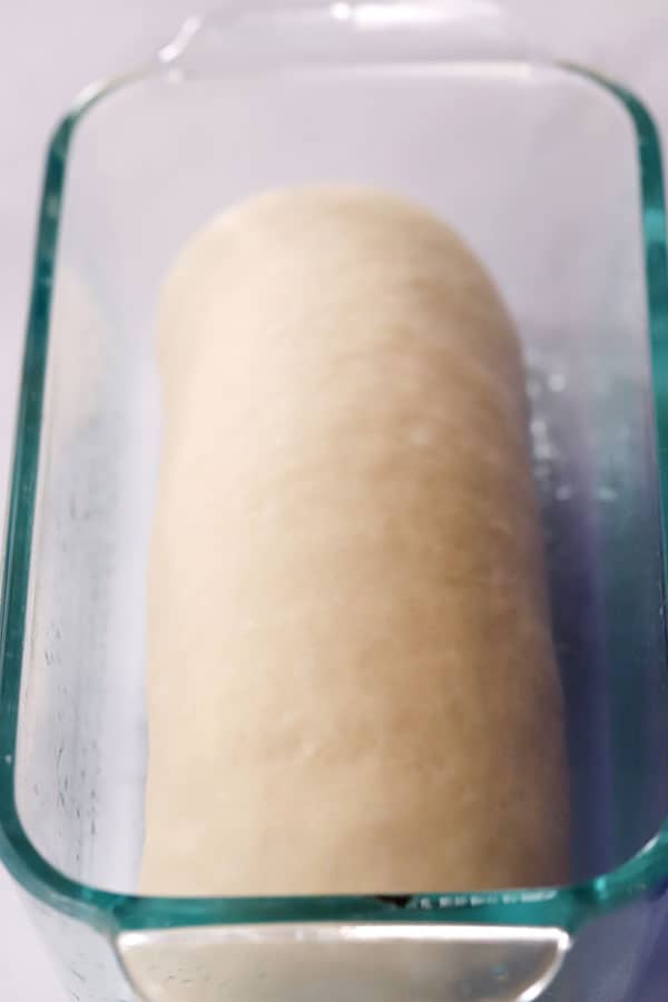  easy white bread recipe in a glass baking dish, ready to rise,  how to make homemade bread.