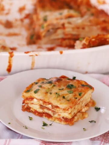 homemade lasagna on a white plate