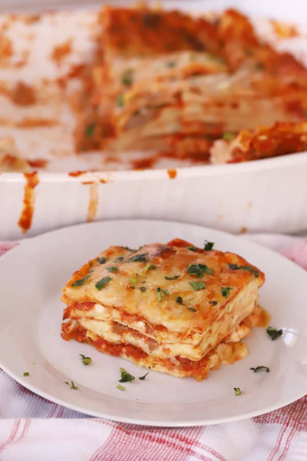 homemade lasagna on a white plate