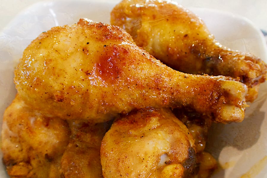 oven baked drumsticks in a bowl.