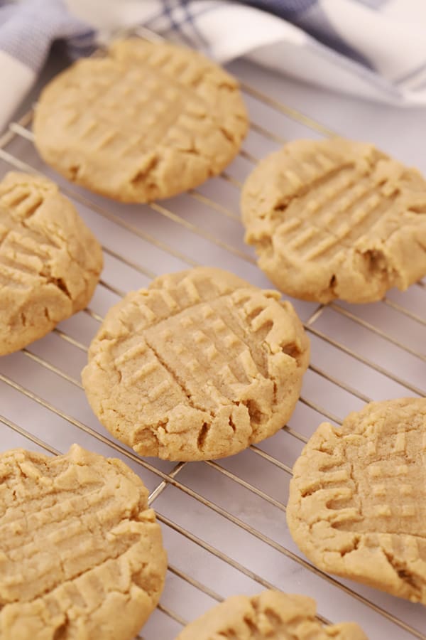 Peanut Butter Cookies with criss cross fork marks on a cooling rack
