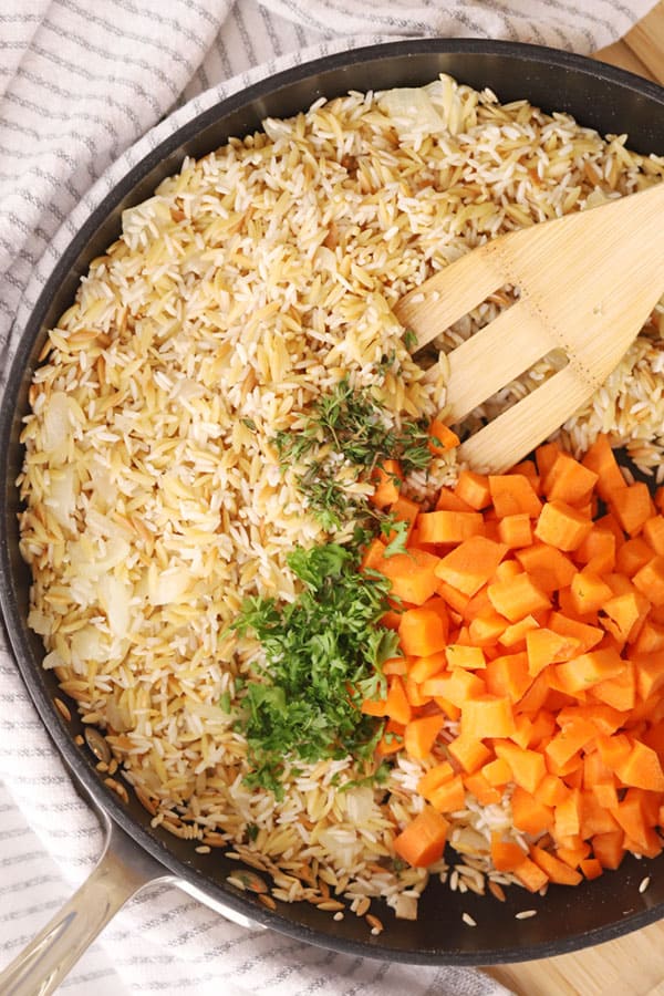 Ingredients for Homemade Rice Pilaf in a saute pan ready to cook