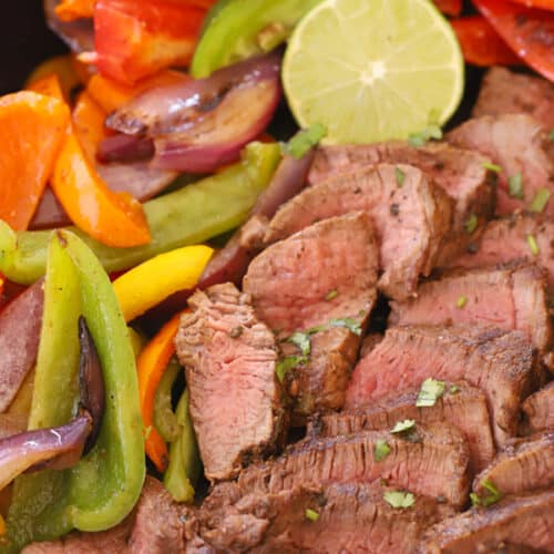 steak fajita in a cast iron skillet