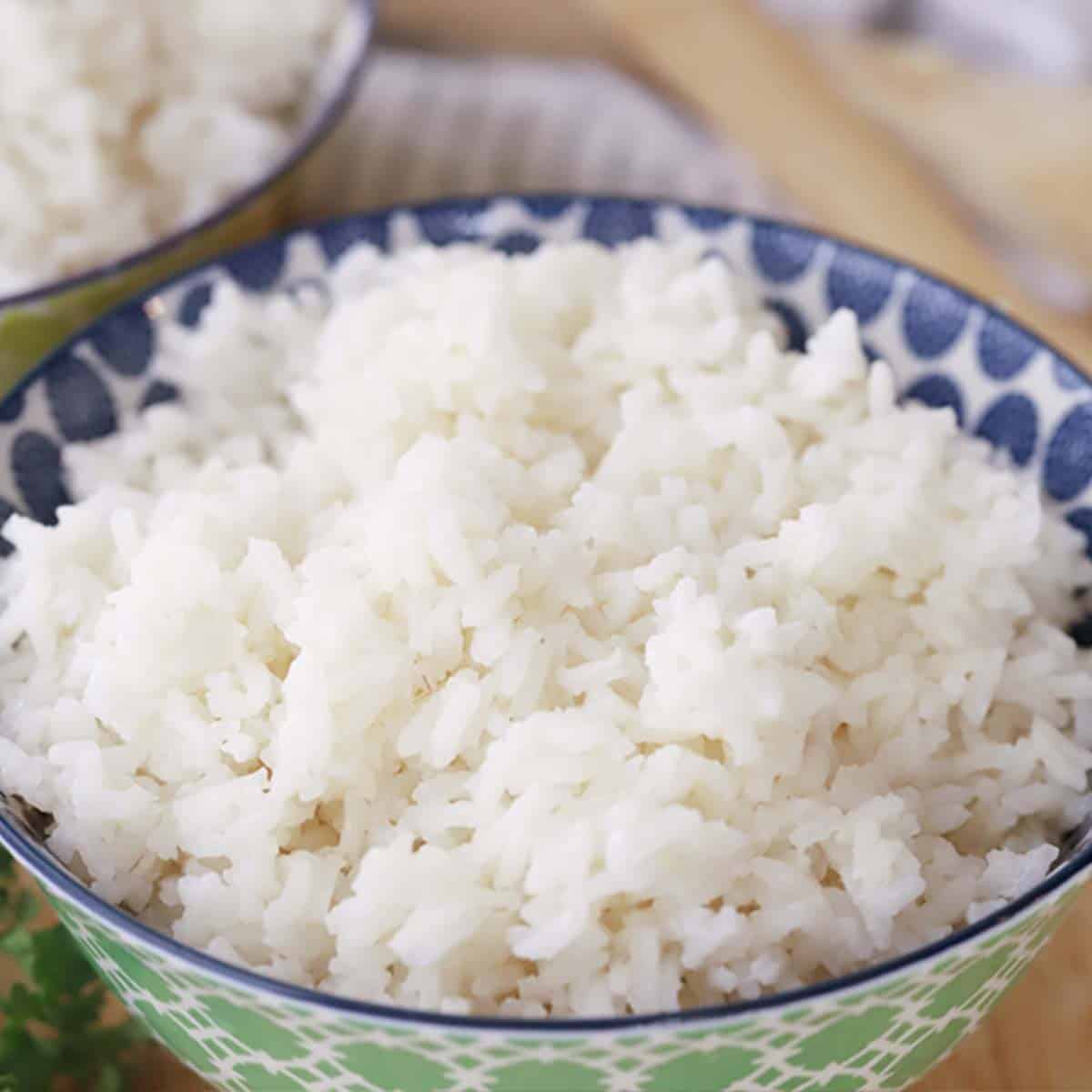 coconut rice in a green bowl, ready to be served