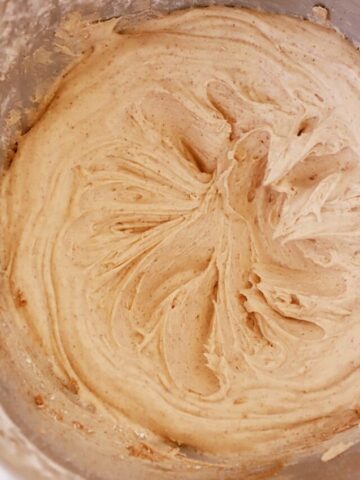 cinnamon buttercream frosting in a large mixing bowl