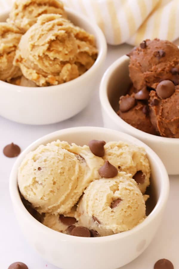 Three bowls with scoops of edible cookie dough.