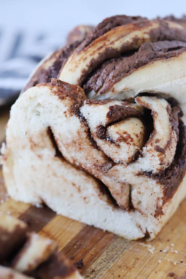 nutella twist bread but up on a wood cutting board, the best homemade bread recipe