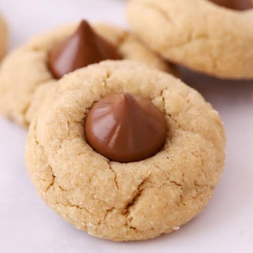 peanut butter blossom cookies on parchement paper