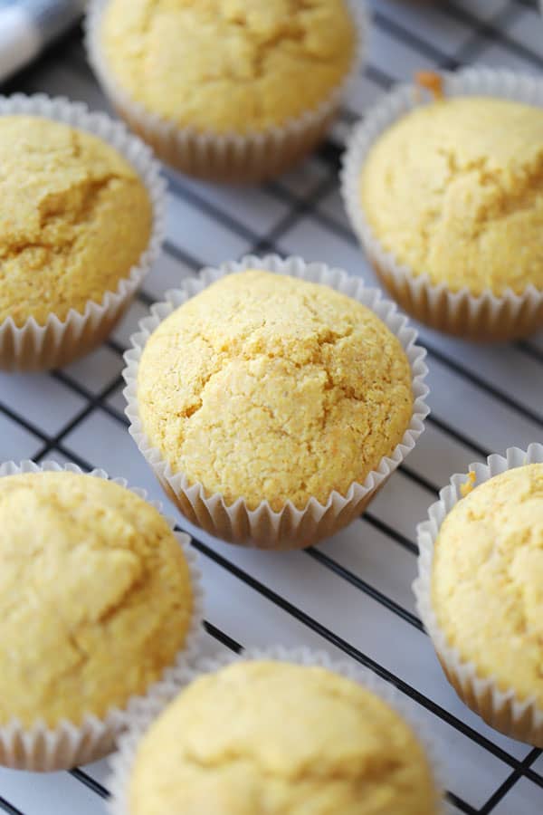 cornbread muffins cooling on a rack, the best corn muffin recipe, corn muffin recipes.